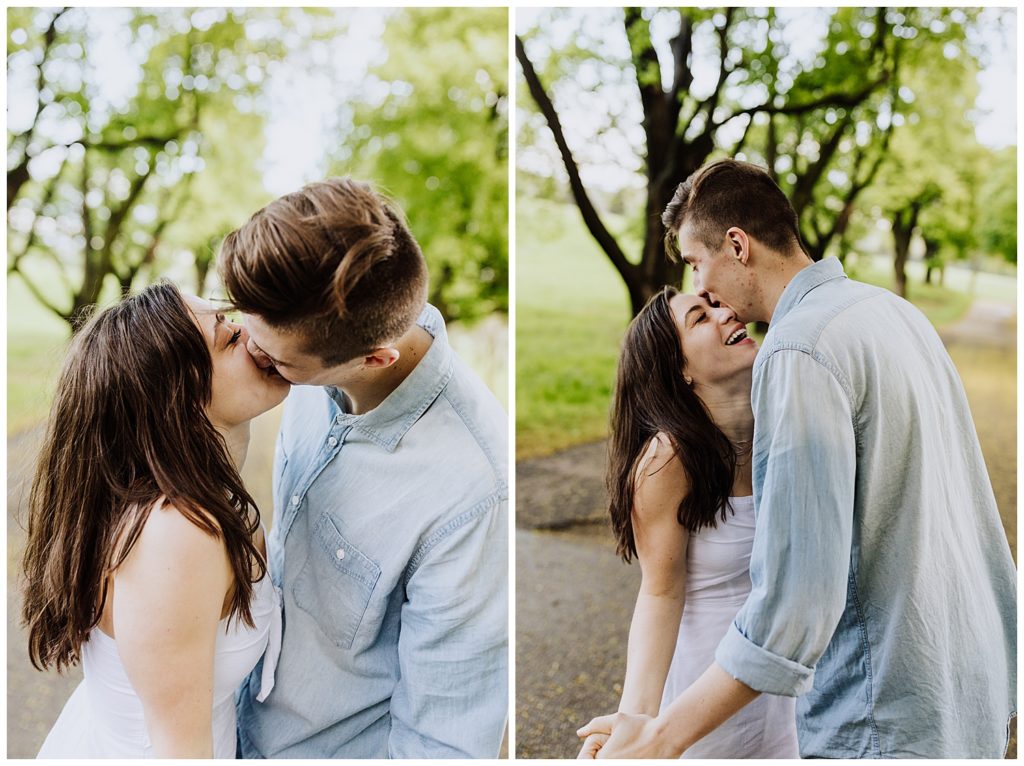 couple pose kissing and laughing