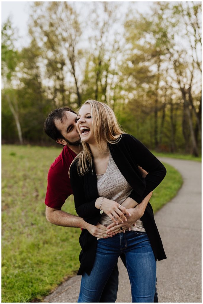 couple pose laughing