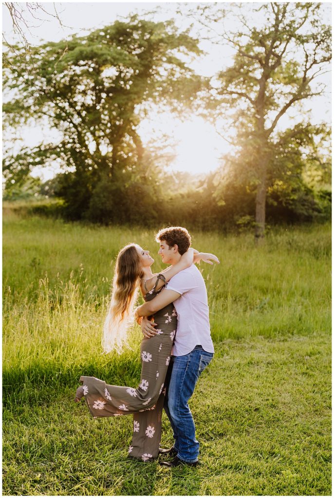 couple dancing in field of grass