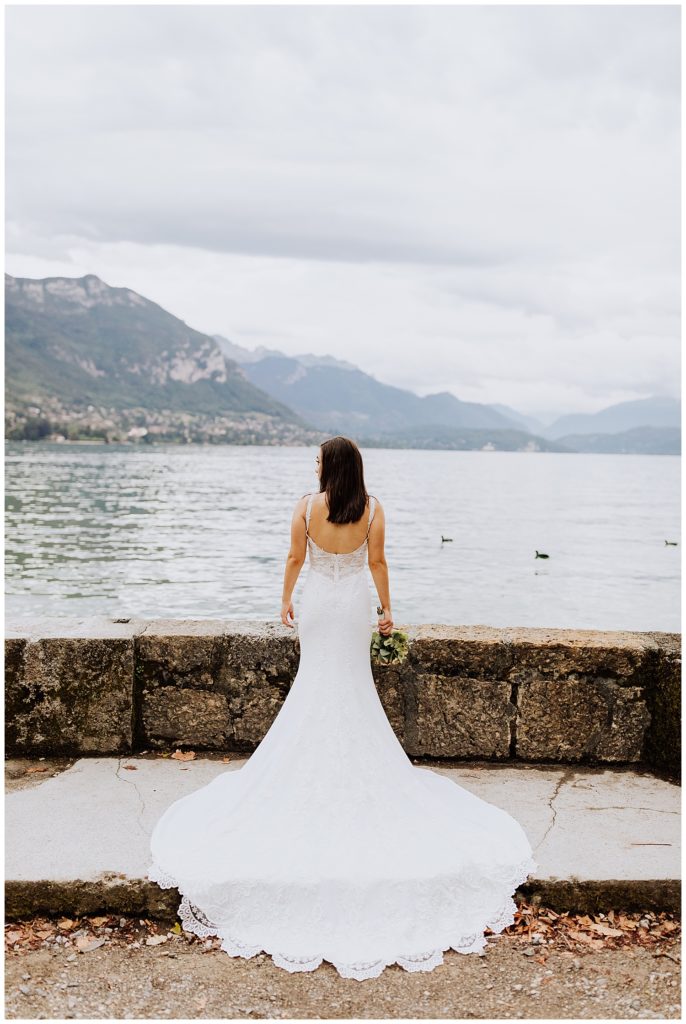 bride in front of mountains and lake in annecy france