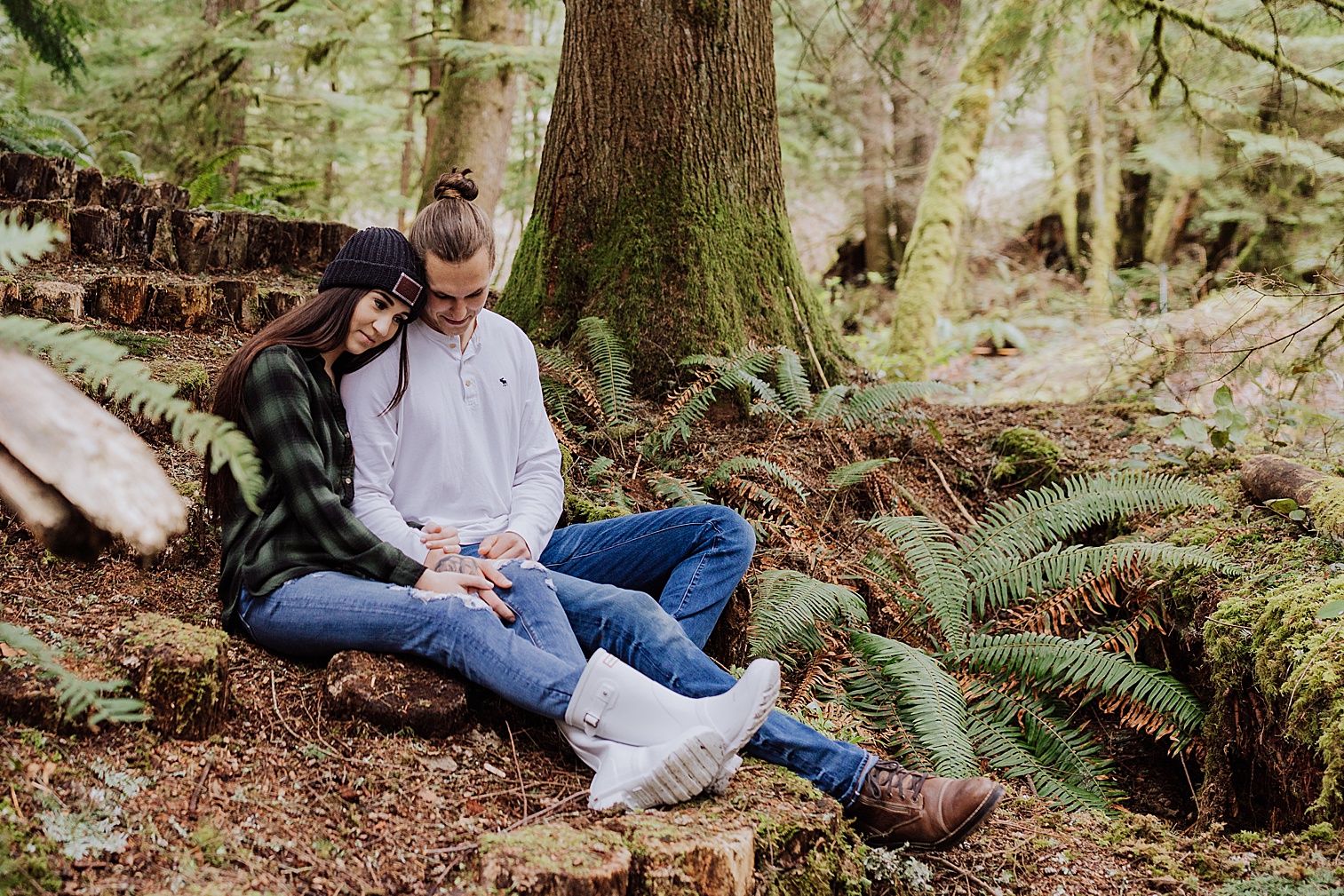 Oregon couple sitting in woods