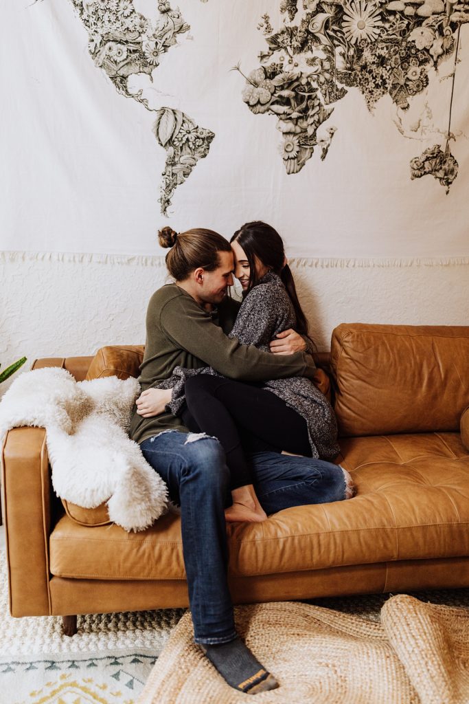 oregon couple cuddling on couch