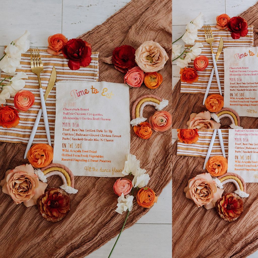 wedding detail flat lay menu, flowers, silverware, rainbows