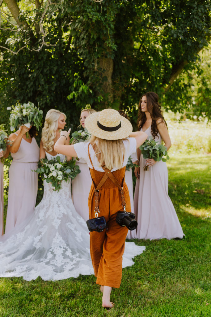 Photographer taking photo of bridal party