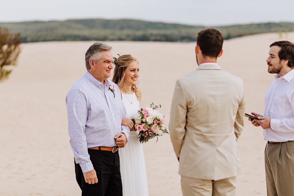 bride and father on beach