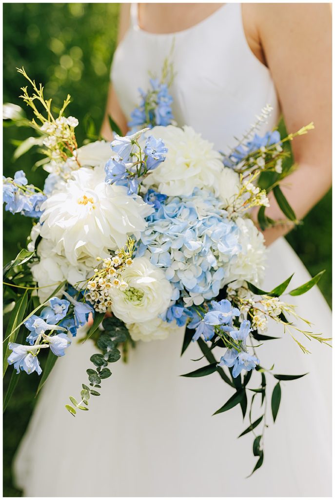 Bridal bouquet with white and blue florals for Cushing Field House wedding