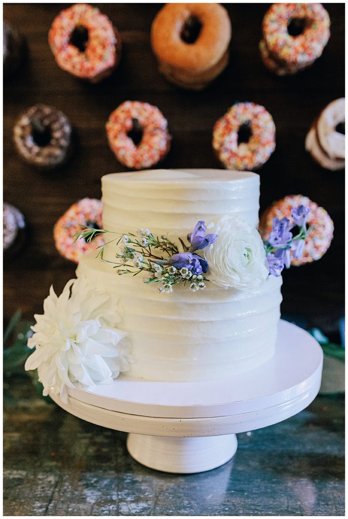 Incredible white wedding cake with florals by Detroit Wedding Photographer
