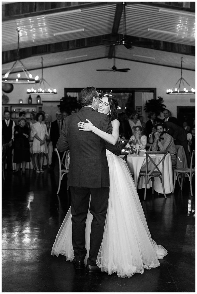 Bride dances with father by Kayla Bouren Photography