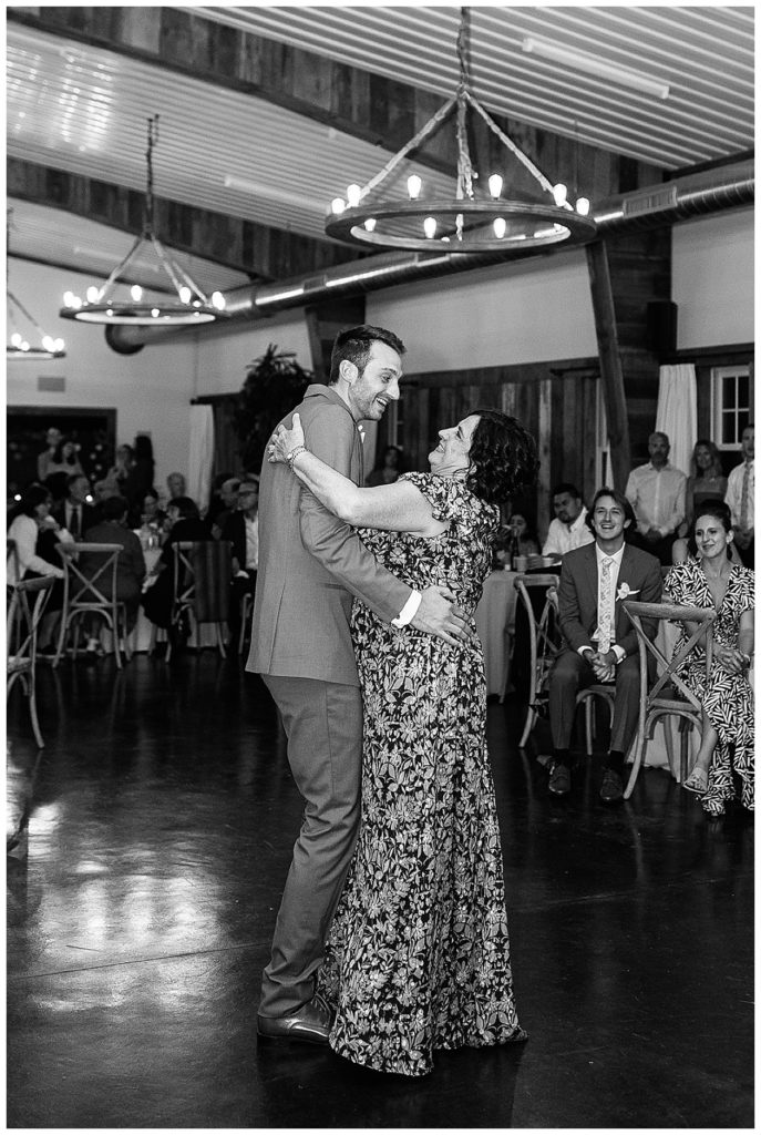 Groom and mother dance during Cushing Field House wedding