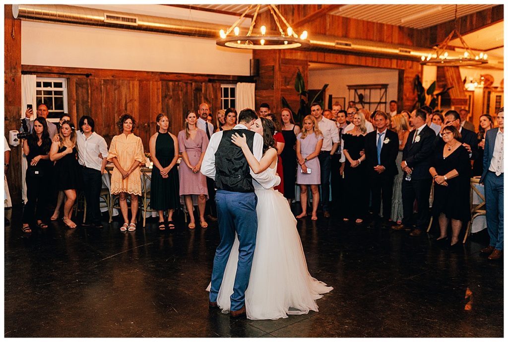 Family and friends surround husband and wife by Detroit Wedding Photographer