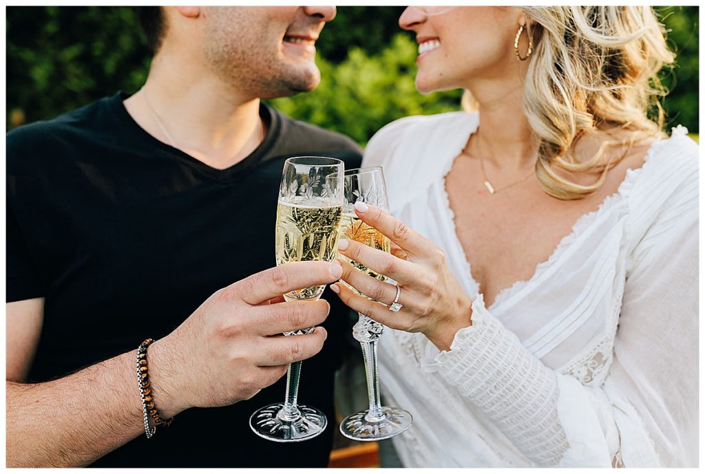 Champagne glass cheer during Grosse Pointe Engagement Session