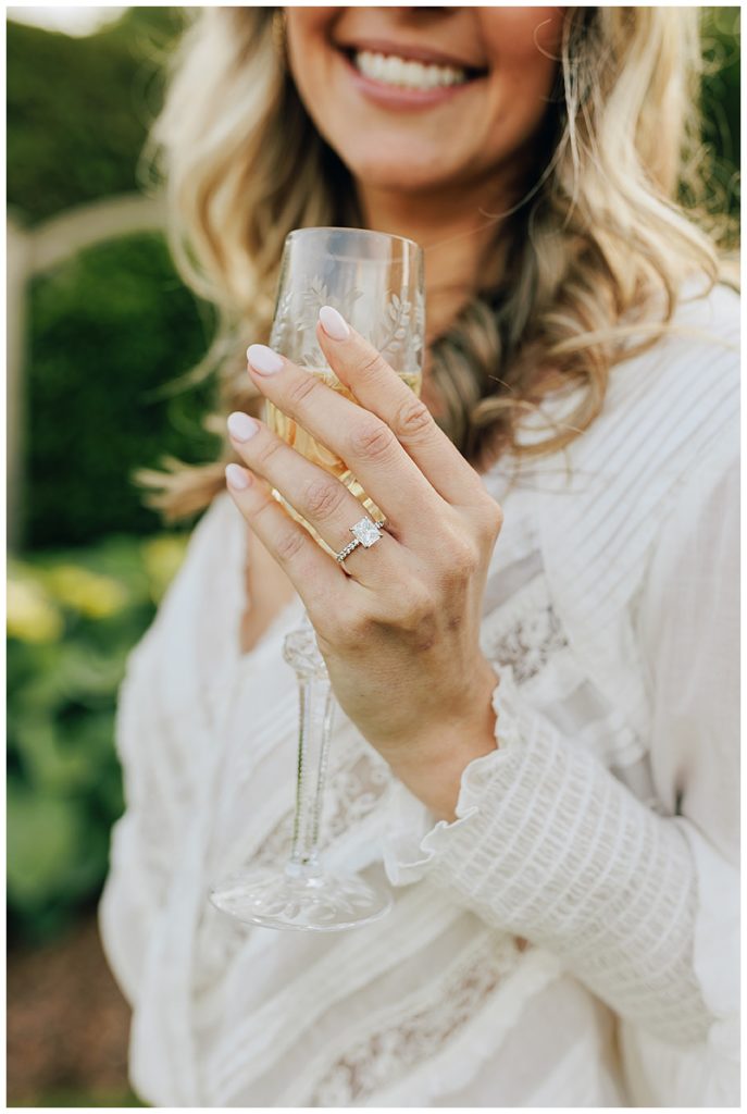 Engagement ring and champagne glass by Detroit Wedding Photographer