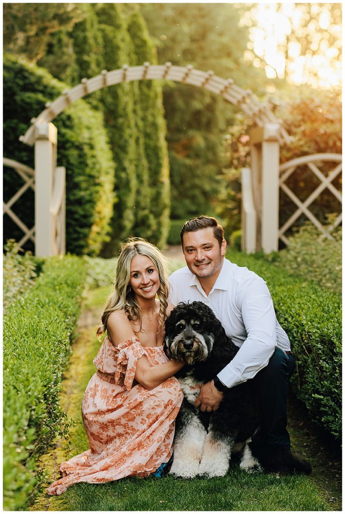 Man and woman hold dog during Grosse Pointe Engagement Session