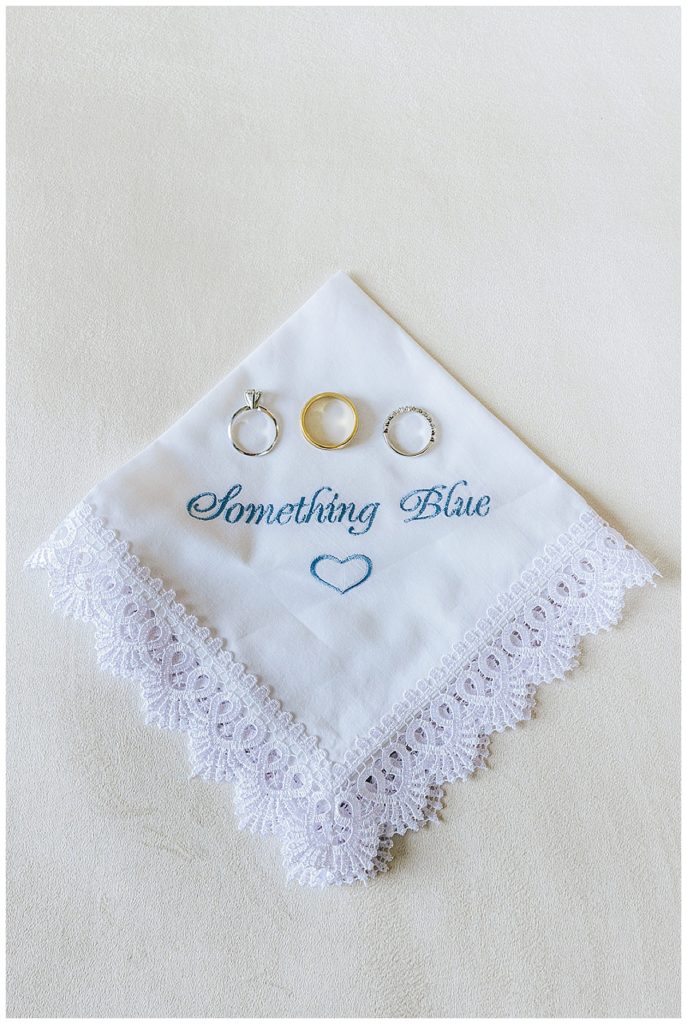 Something blue linen with bride and groom rings for elegant Yacht Club wedding.