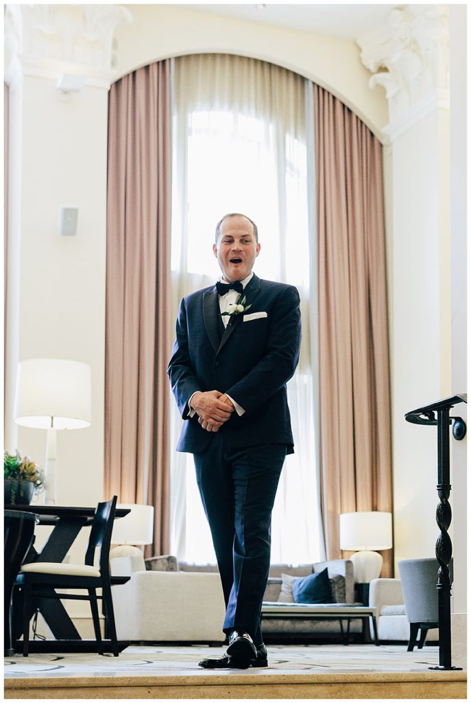 During their first look, groom is overcome with joyous emotion by Kayla Bouren photography.