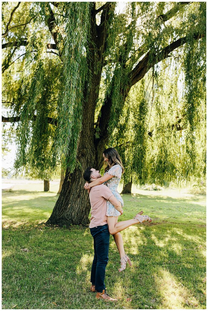 Couple hugs under willow tree Kayla Bouren Photography