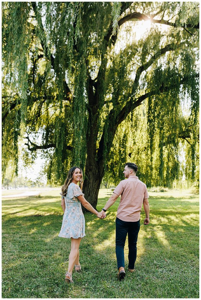 Hand in hand couple by willow tree for Detroit Wedding Photographer