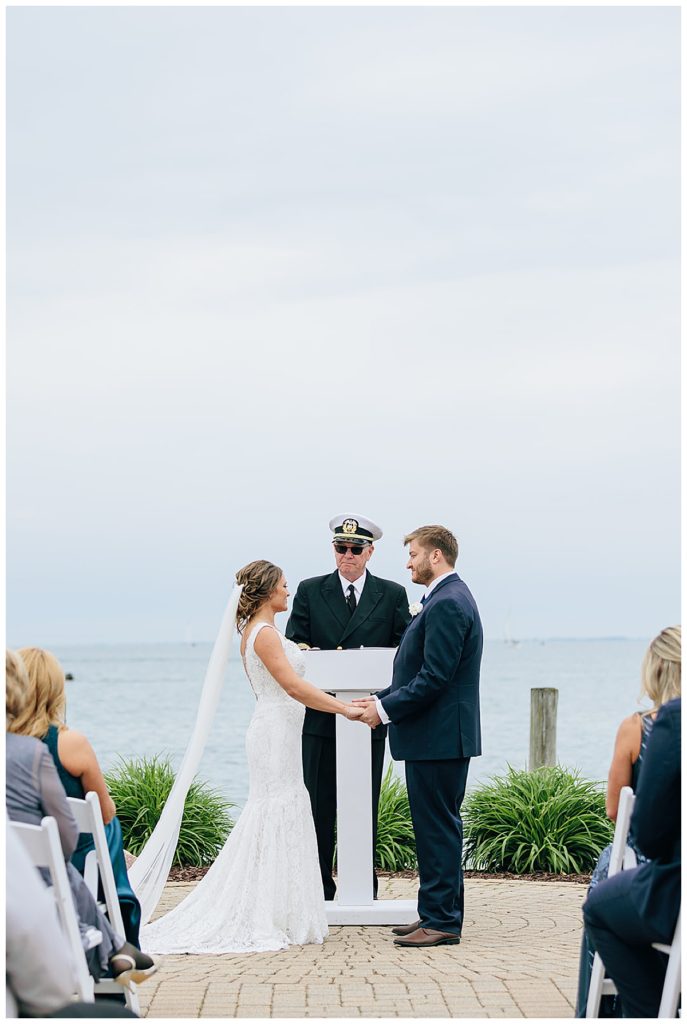 Bride and groom embrace at ceremony Kayla Bouren Photography.