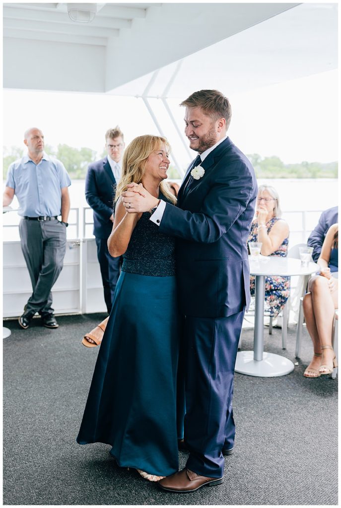 Groom and mother dance by Kayla Bouren Photography.