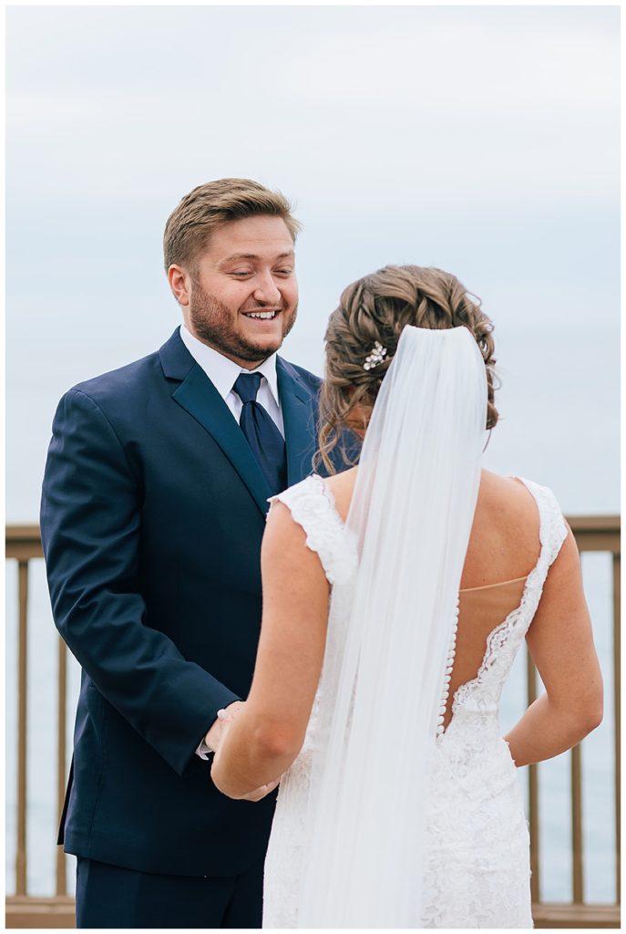 Groom smiles at bride for Detroit wedding photographer