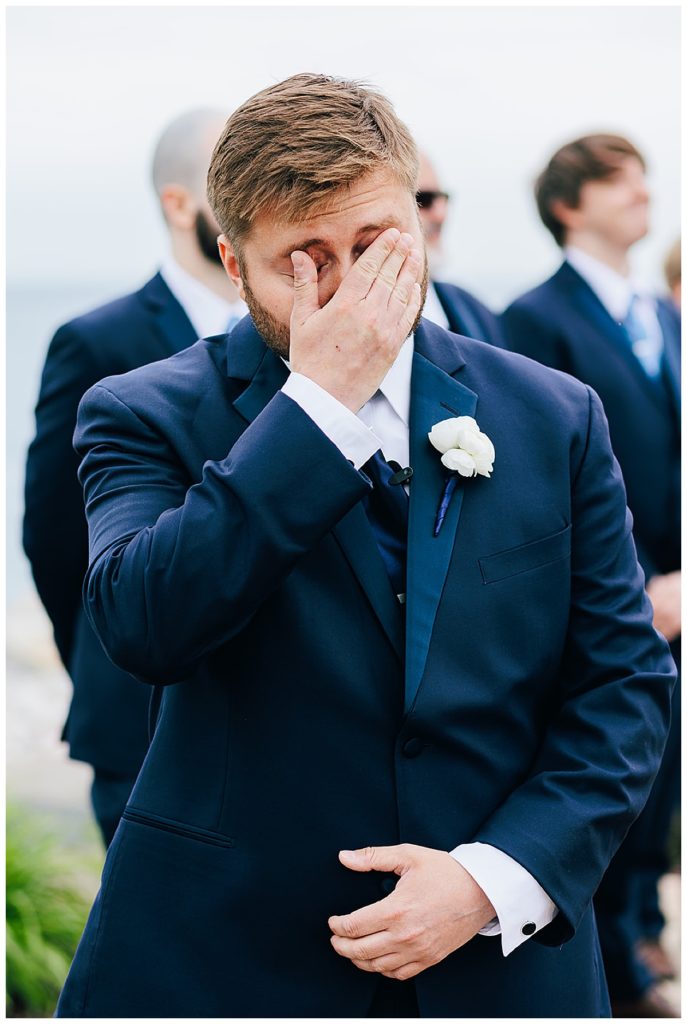 Groom wipes tears at Lake St.Clair wedding