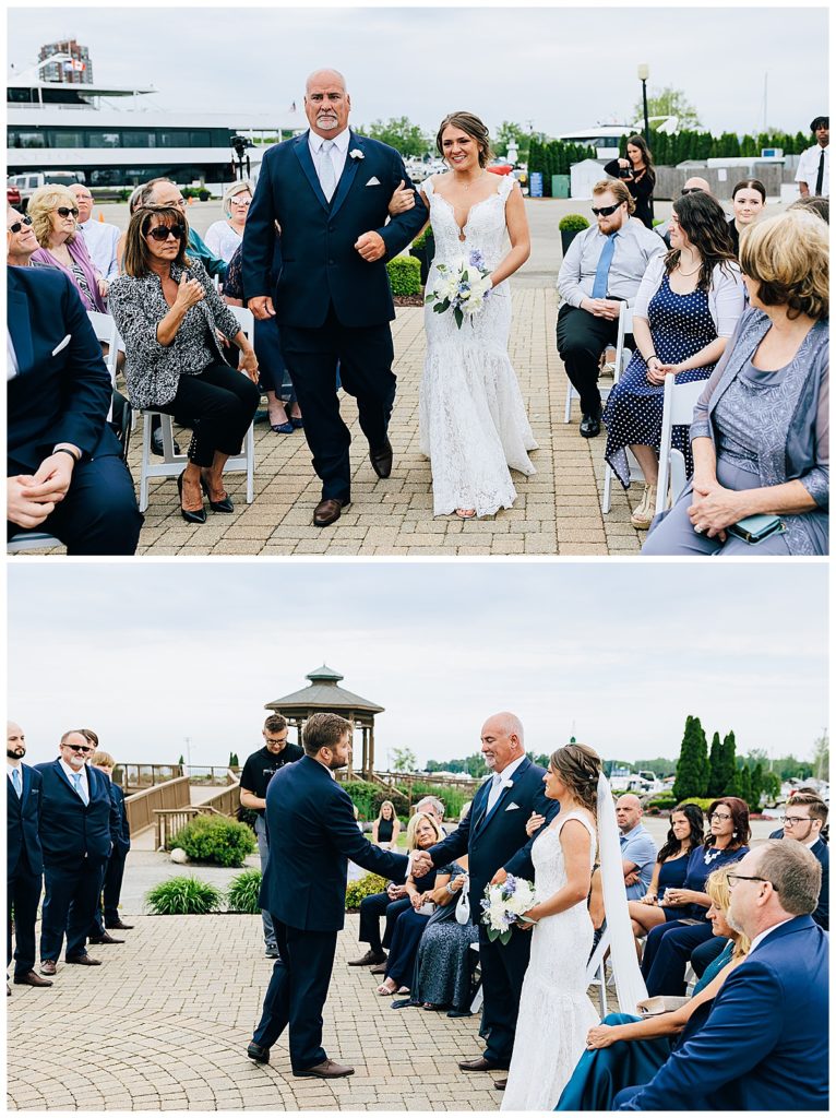Bride is heloed down the aisle with father during Lake St.Clair wedding