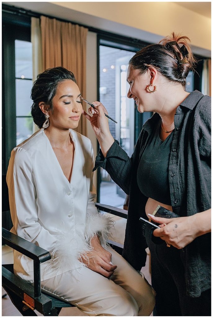 Bride getting makeup done for Chic Detroit Wedding