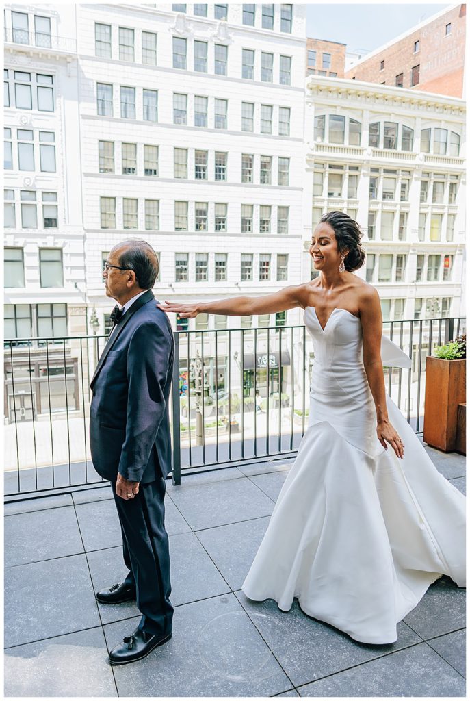 Bride taps father on shoulder by Kayla Bouren Photography