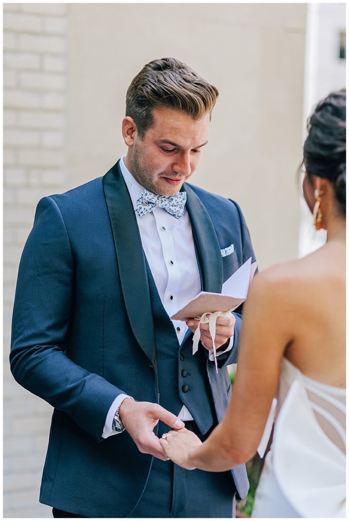 An emotional groom reads vows to bride during Chic Detroit Wedding