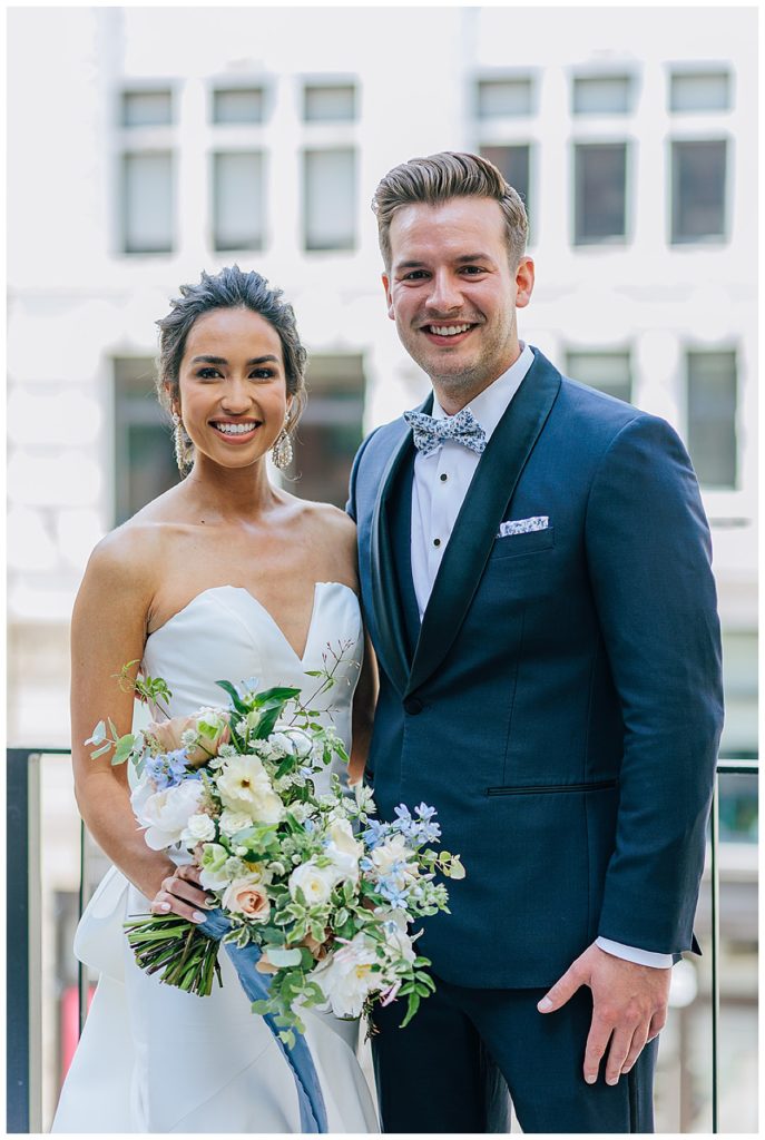 Bride and groom share a smile during Chic Detroit Wedding