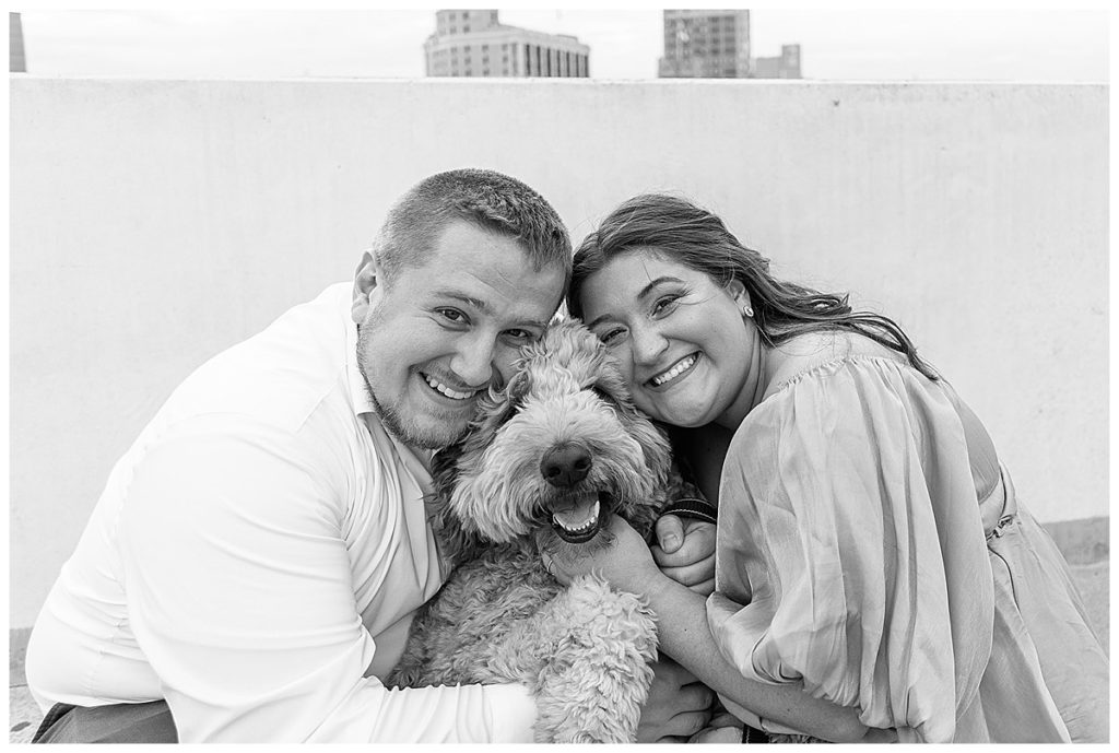 Dog smiles big in between parents for Kayla Bouren Photography