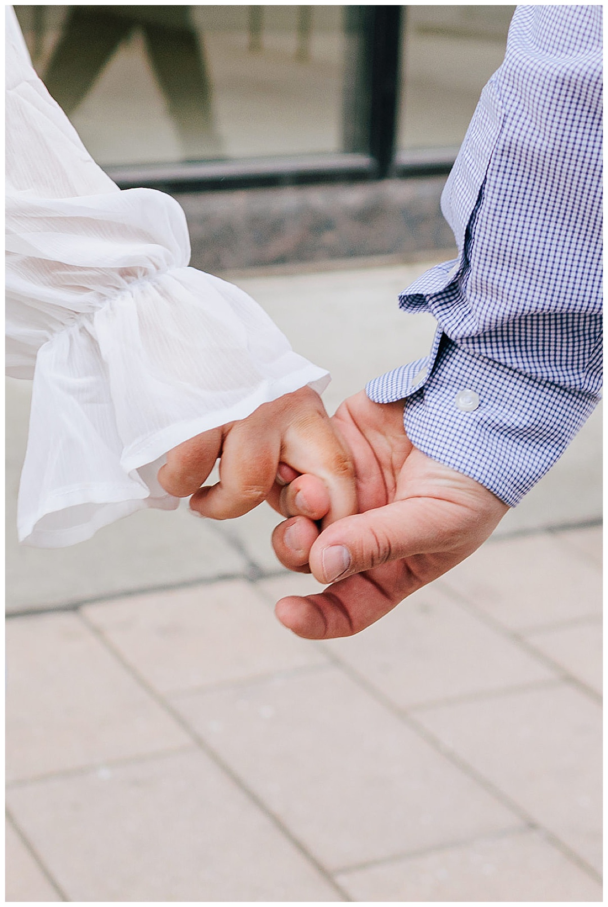 Man and woman holding hands for Detroit Wedding Photographer