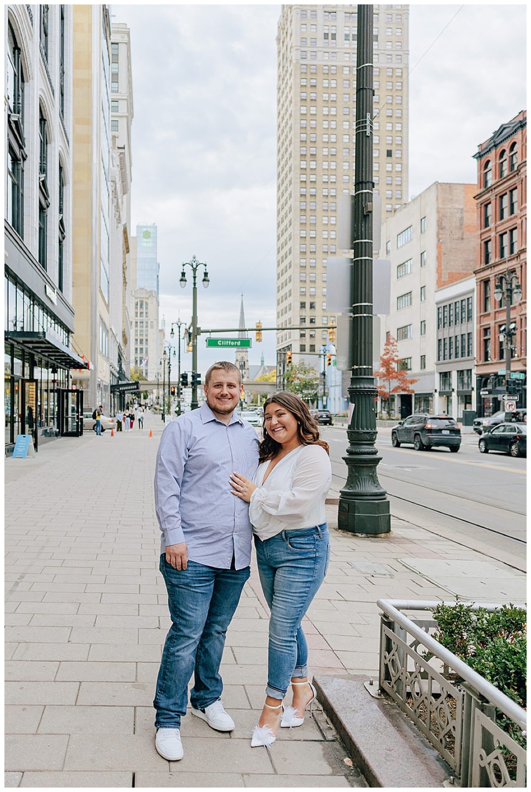 Woman stands near man for Downtown Engagement Session