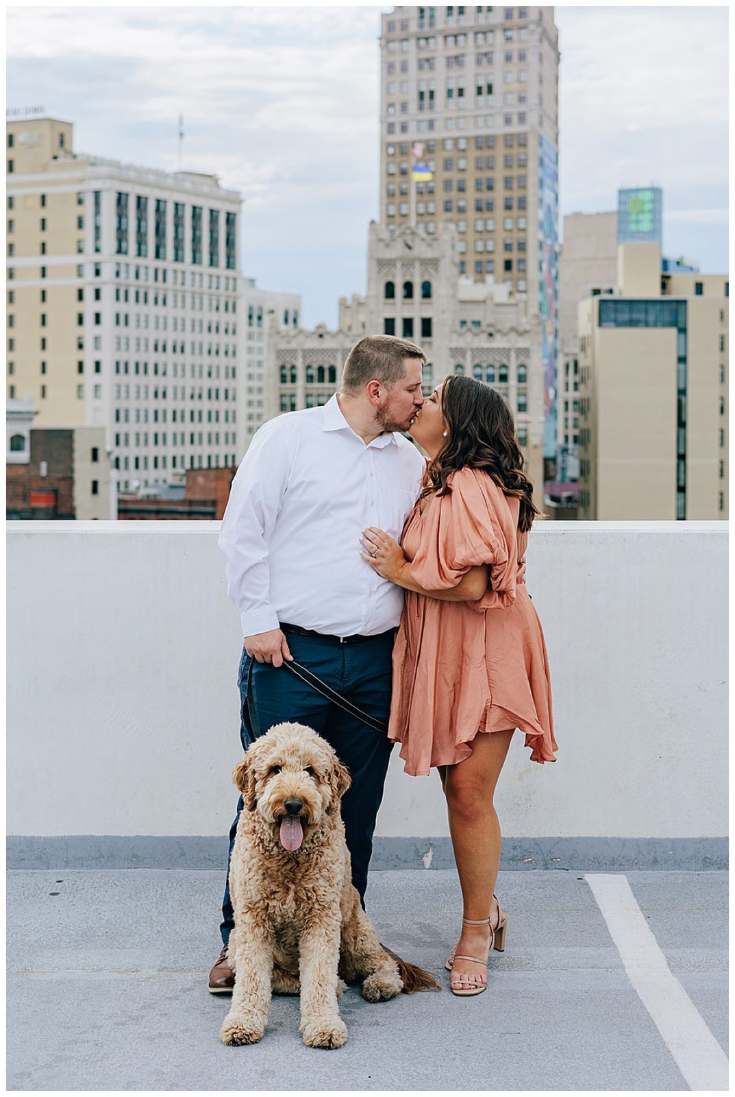 Future husband and wife kiss for Kayla Bouren Photography