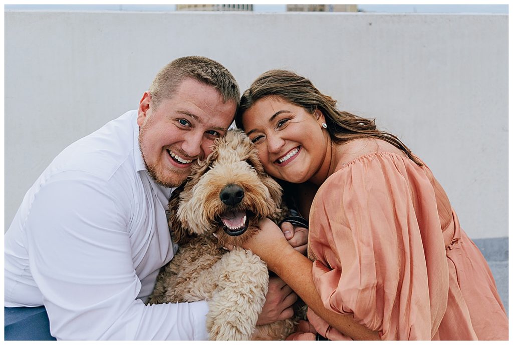 Dog smiles in between humans for Downtown Engagement Session