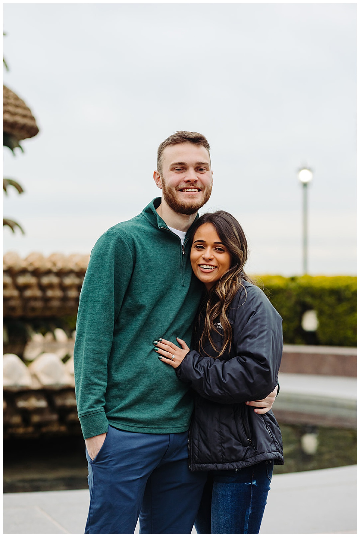 Couple grins while leaning on each other for Kayla Bouren Photography