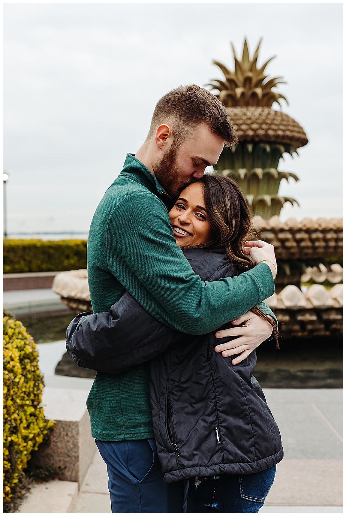 Couple hugs after surprise proposal