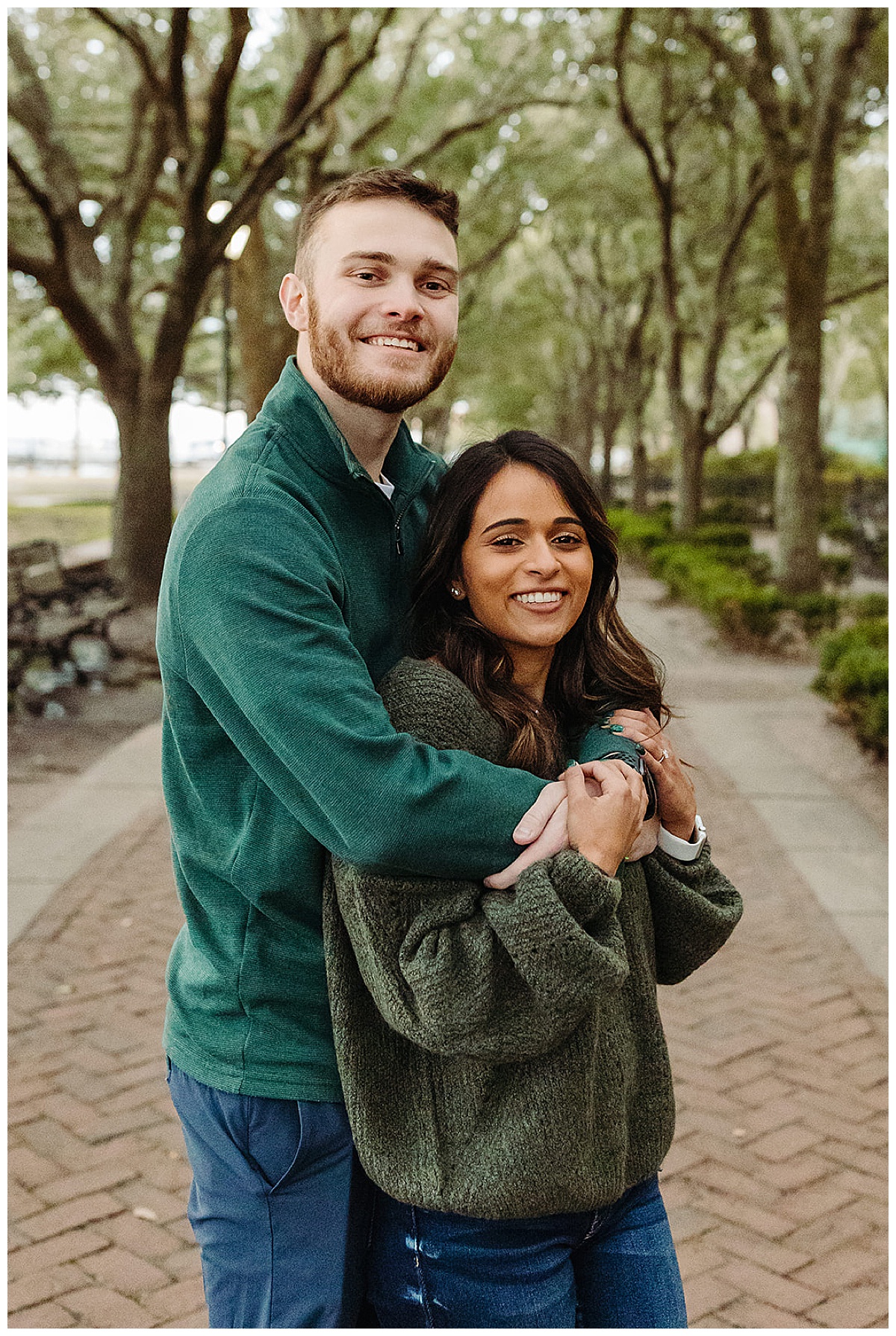 Arms wrapped around fiancé for Detroit Wedding Photographer