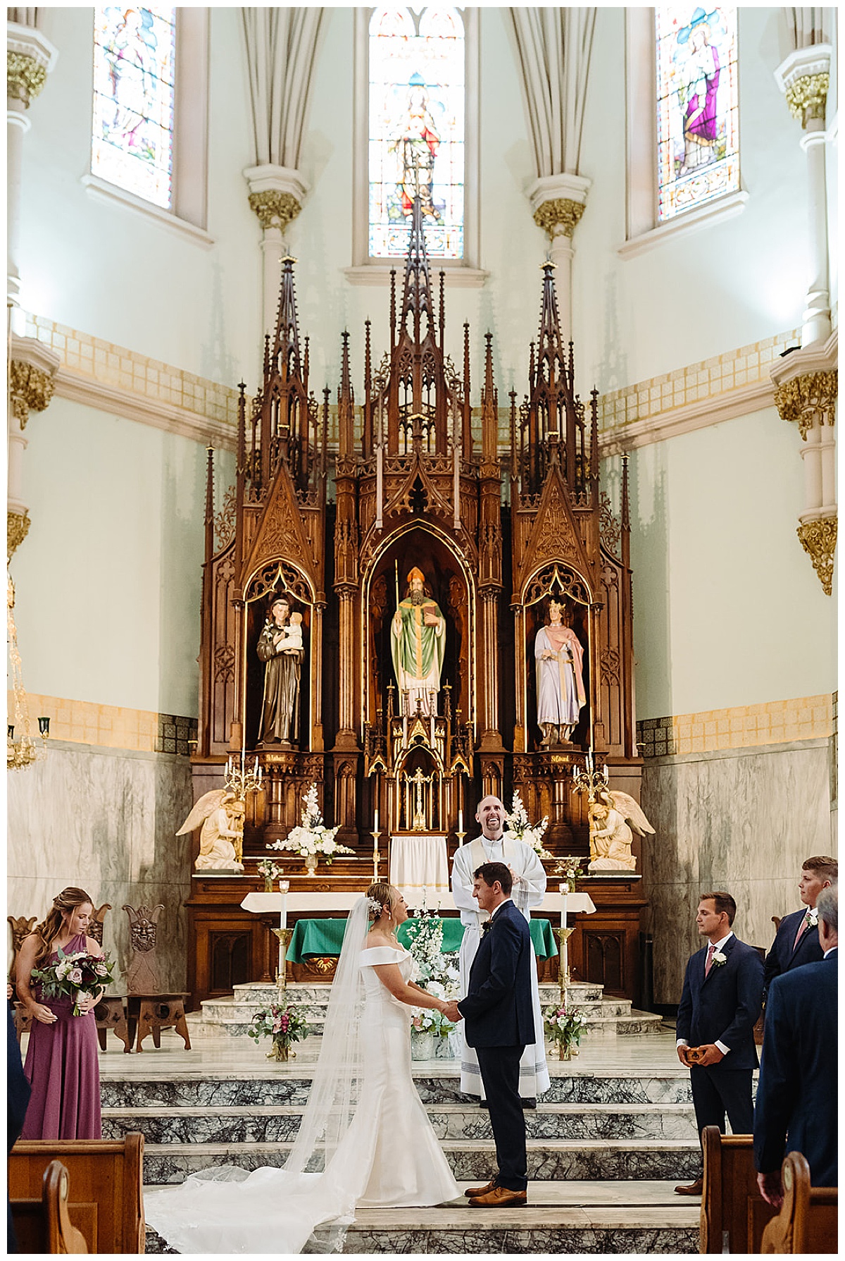 Couple holds hands in church for Kayla Bouren Photography