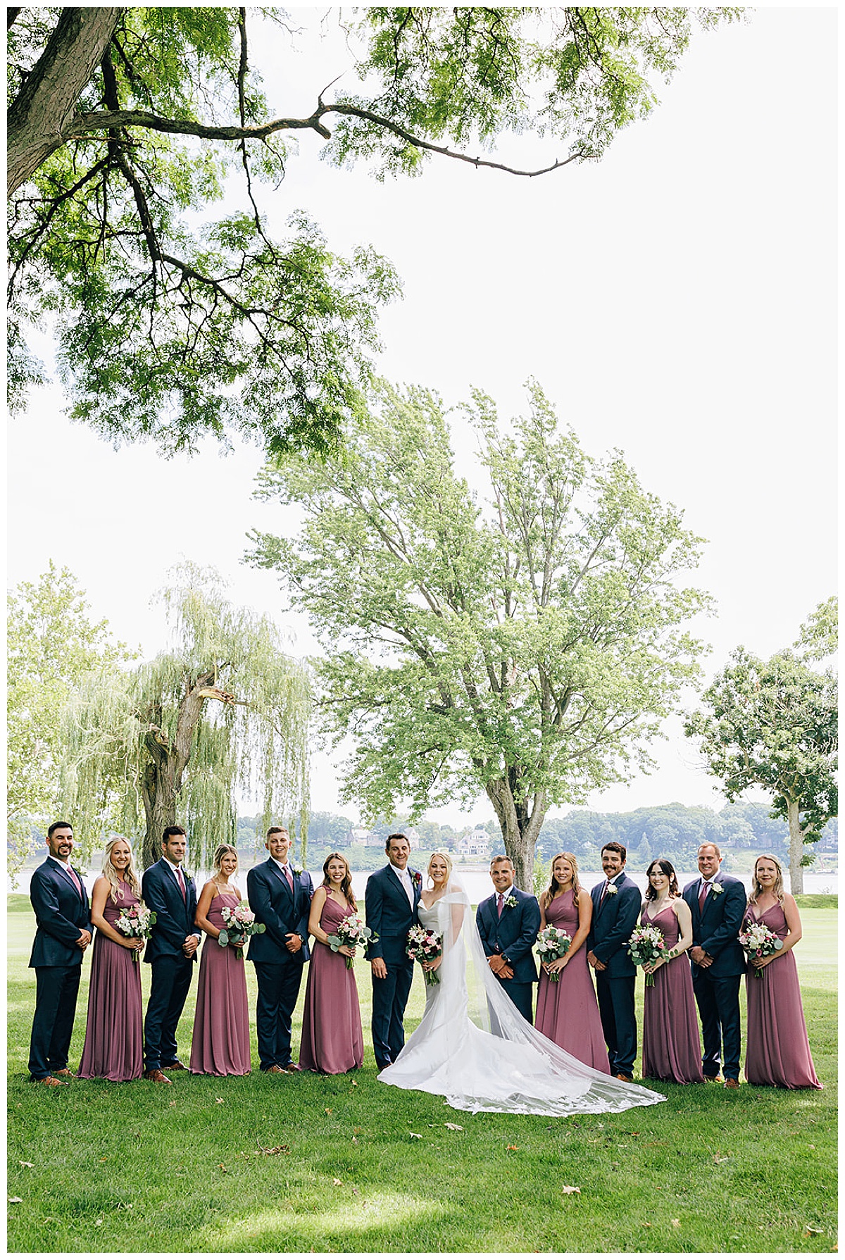 All smiles near bride and groom by Kayla Bouren Photography