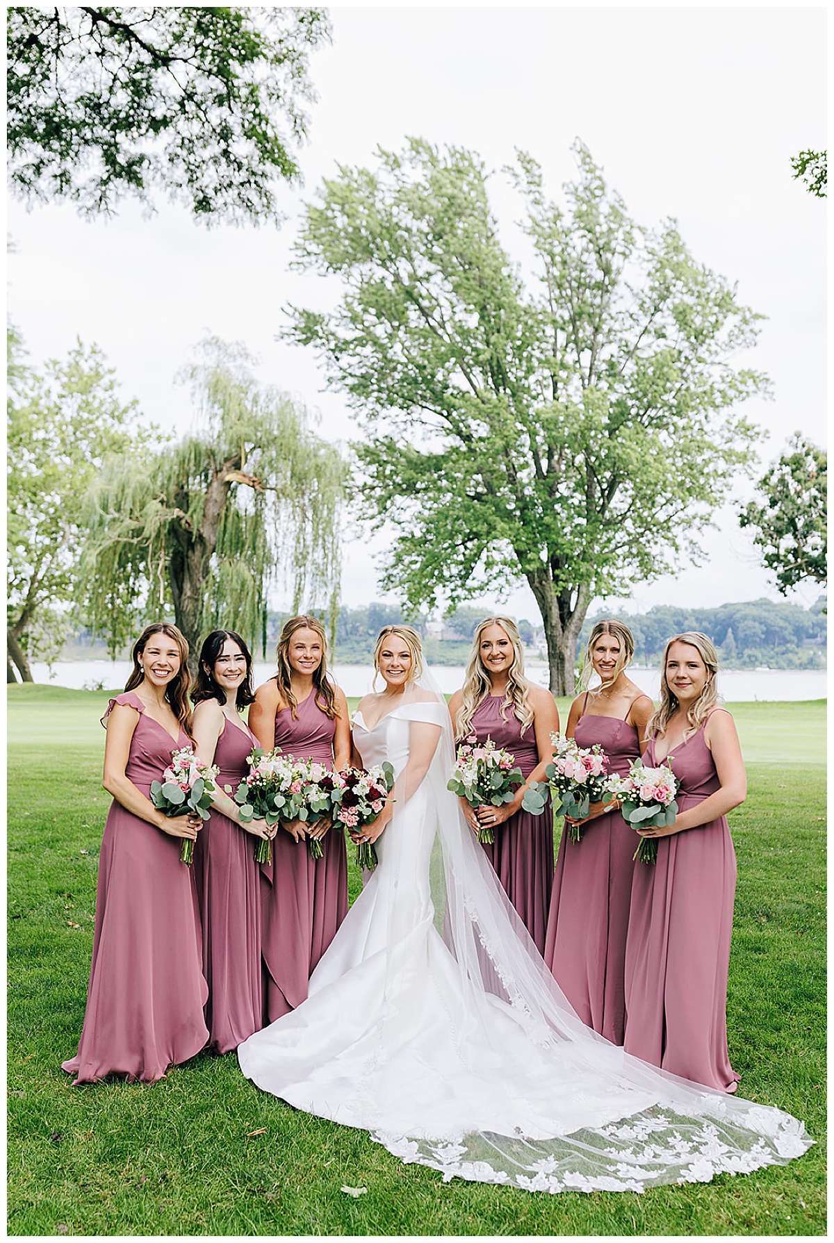 Bride surrounded by bridal party by Detroit Wedding Photographer
