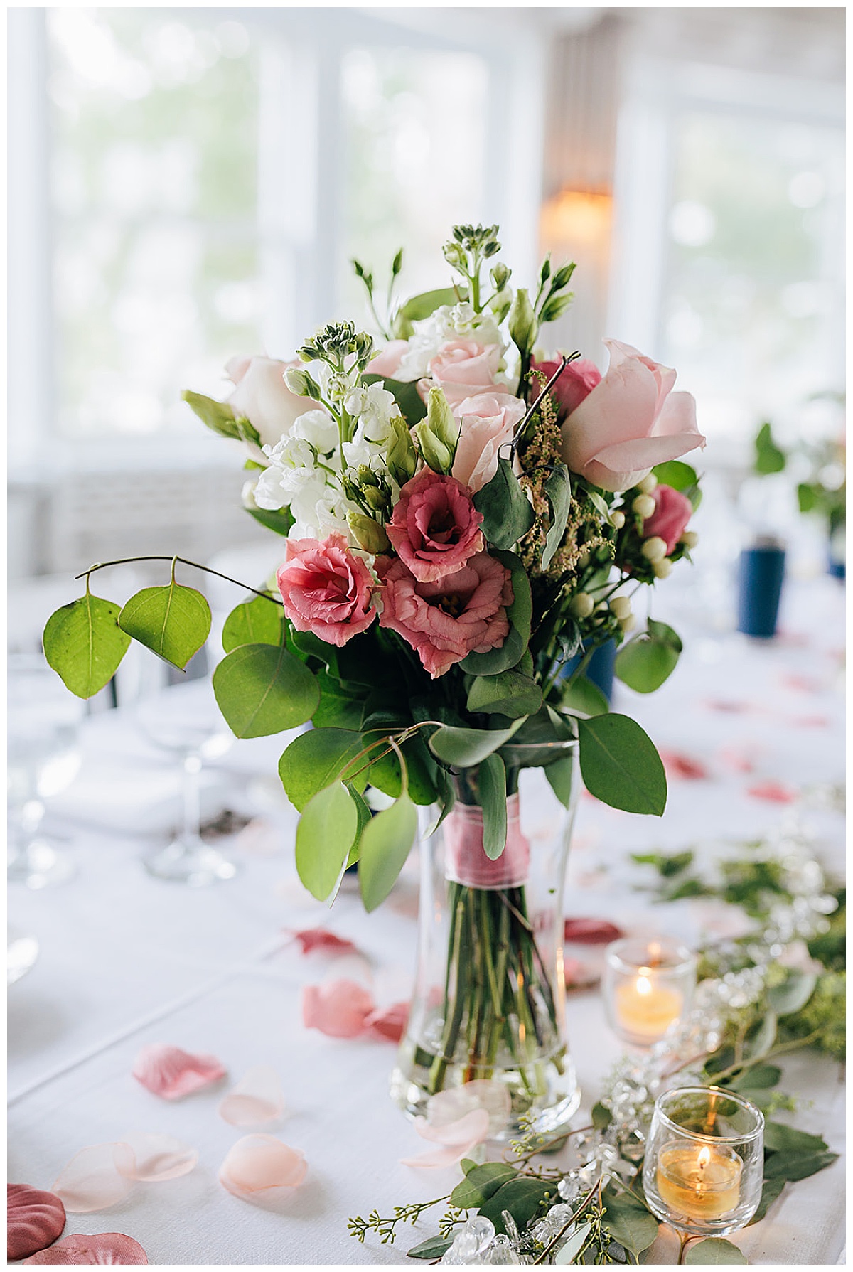 Pink flowers and greenery in vase for Detroit Wedding Photographer