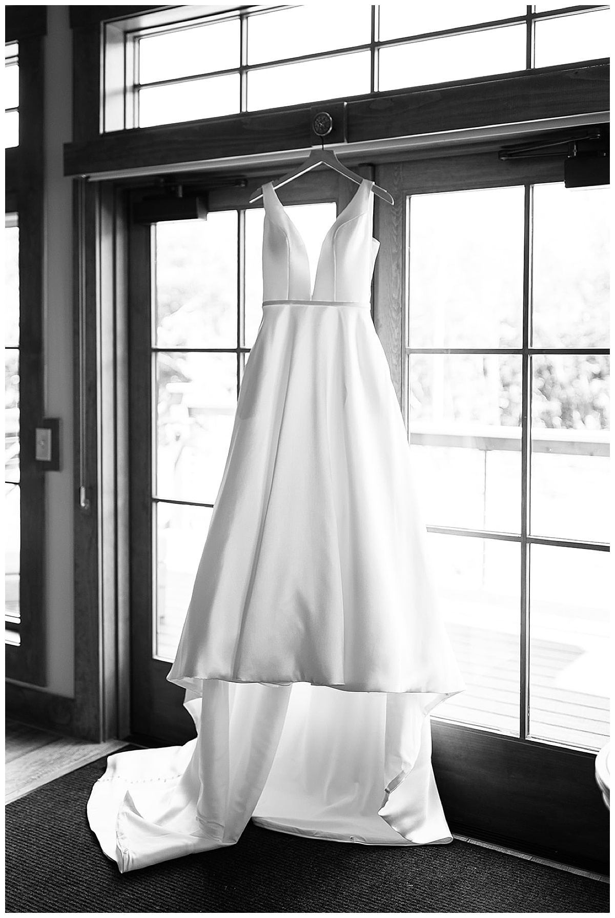 Bridal gown on window at Black River Barn South Haven