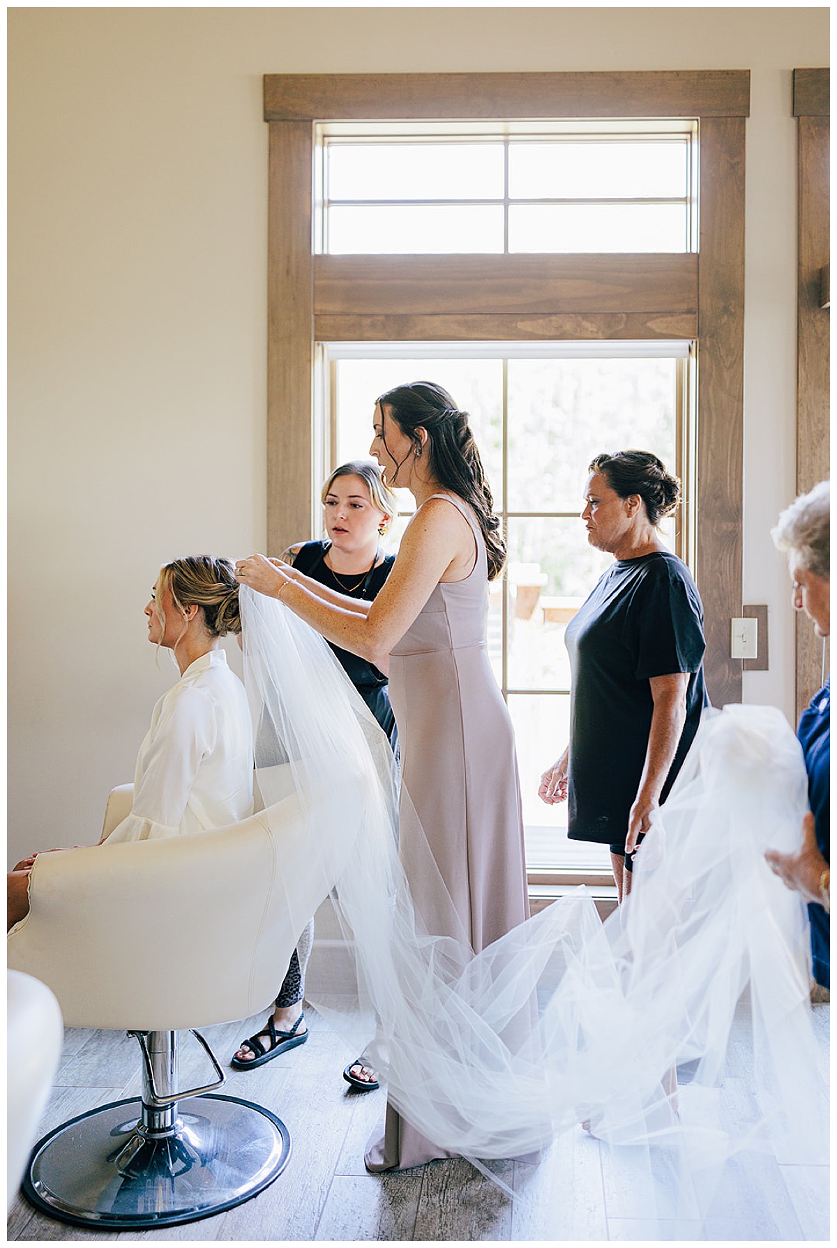 Bride getting veil adjusted for Detroit Wedding Photographer