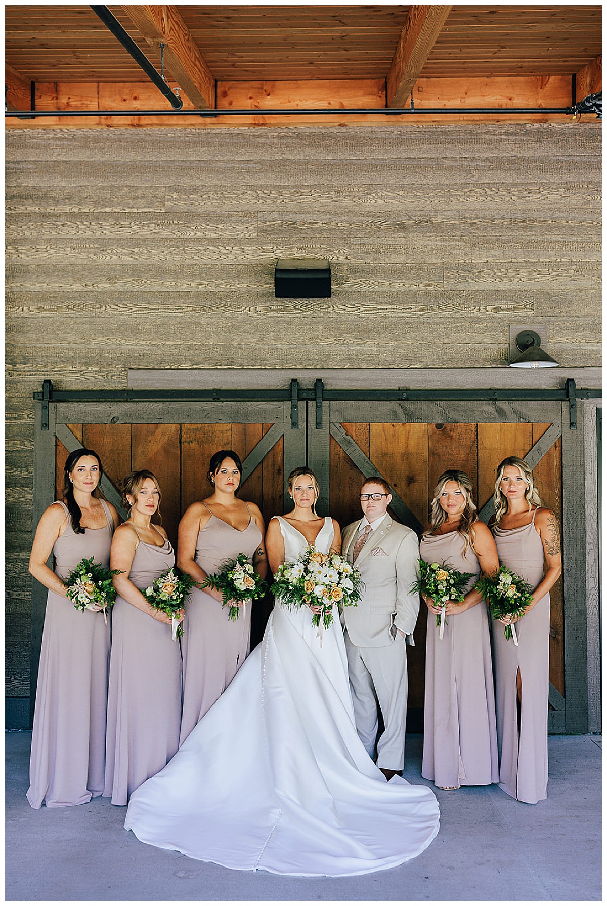 Wedding party holds serious faces at Black River Barn South Haven