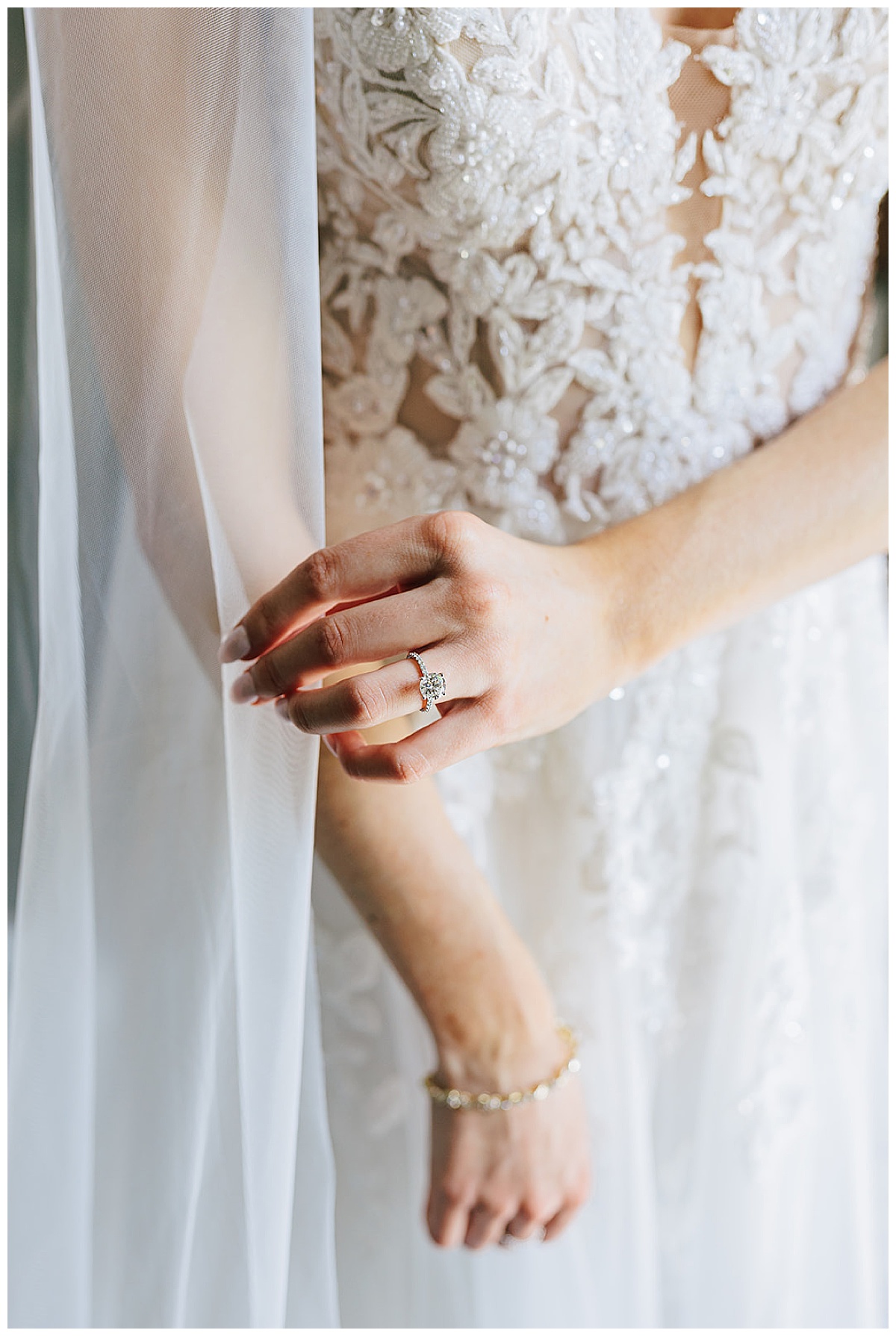 Bride pulling bridal veil for Kayla Bouren Photography
