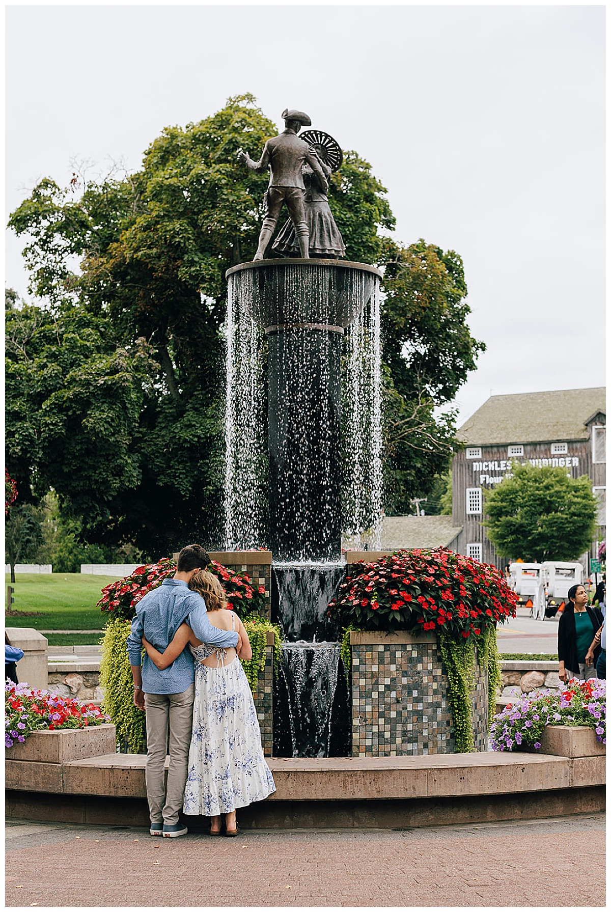 Couple standing together at Zehnder’s Fountain Proposal