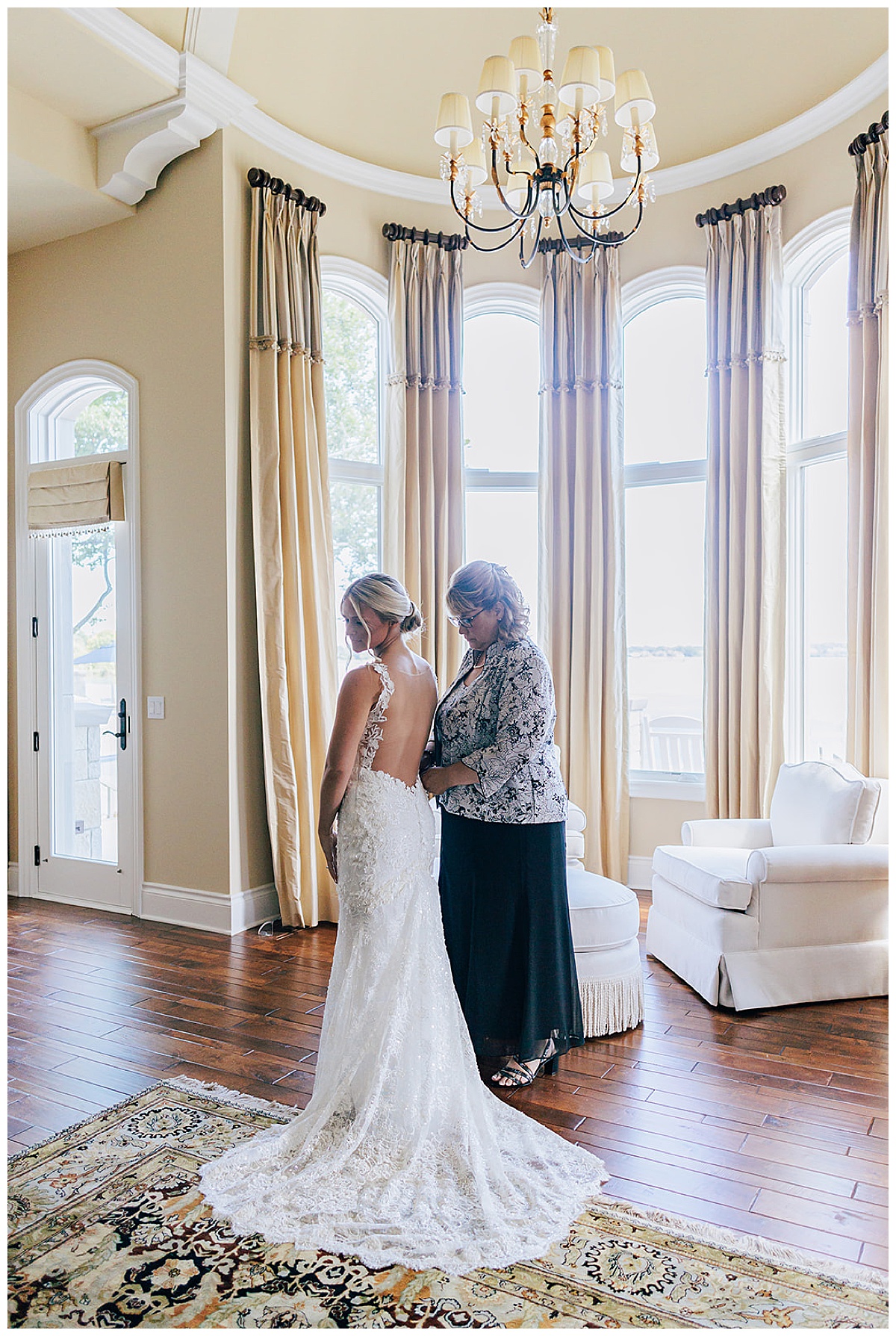 Mother helps daughter with dress for Detroit Wedding Photographer