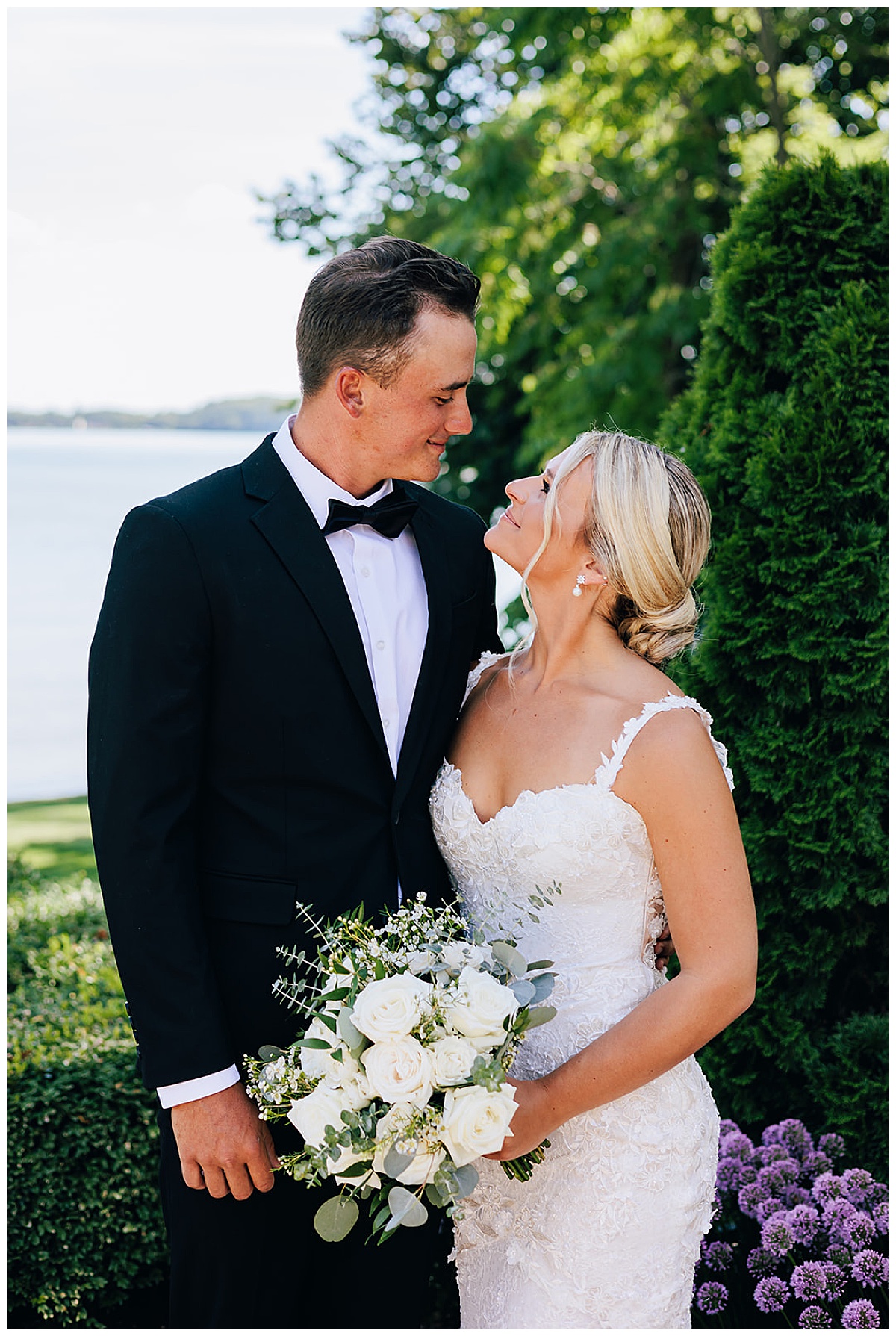 Bride smiles big at groom before Ovation Yacht Charter