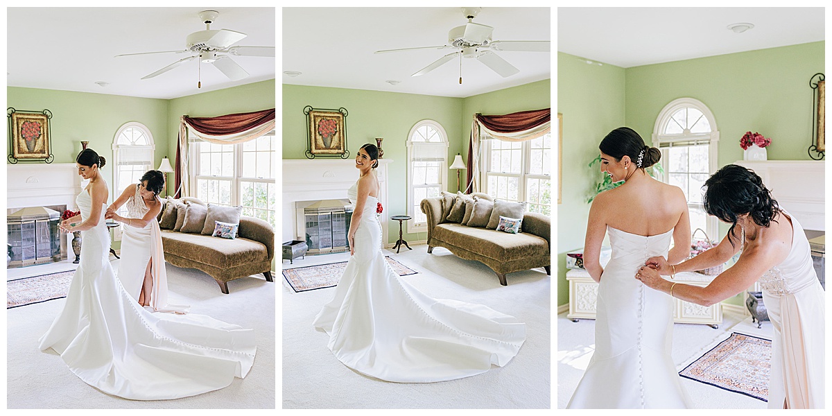 Woman helps bride with dress for Detroit Wedding Photographer
